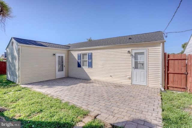 rear view of property featuring a patio