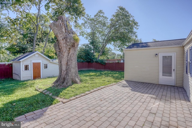 view of patio / terrace with a shed