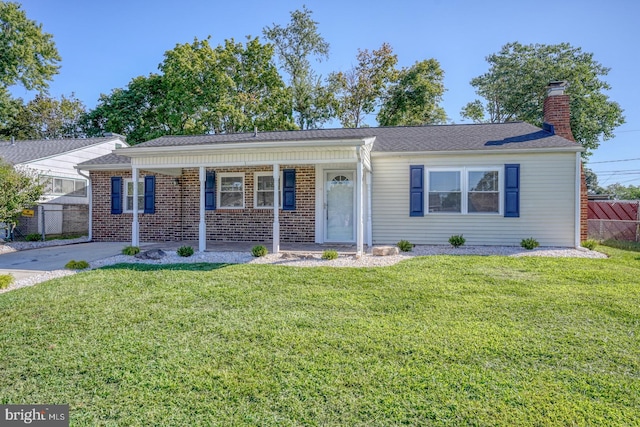 single story home featuring a front lawn