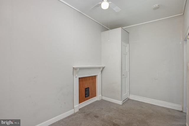 unfurnished living room featuring light carpet and ceiling fan