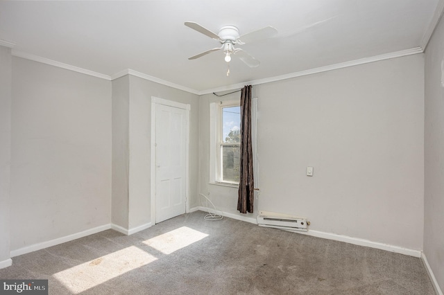 spare room featuring ornamental molding, carpet flooring, and a baseboard radiator