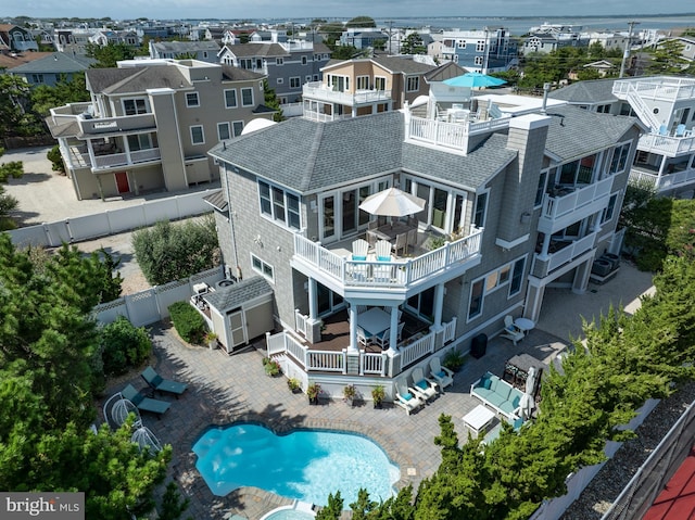 birds eye view of property with a residential view