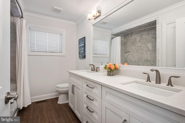 full bath featuring visible vents, a sink, toilet, and wood finished floors