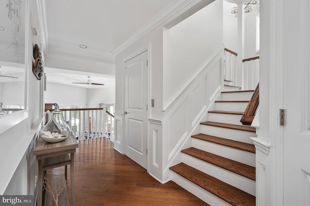 stairs featuring a ceiling fan, recessed lighting, crown molding, and wood finished floors