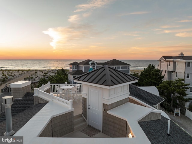 patio terrace at dusk with a water view