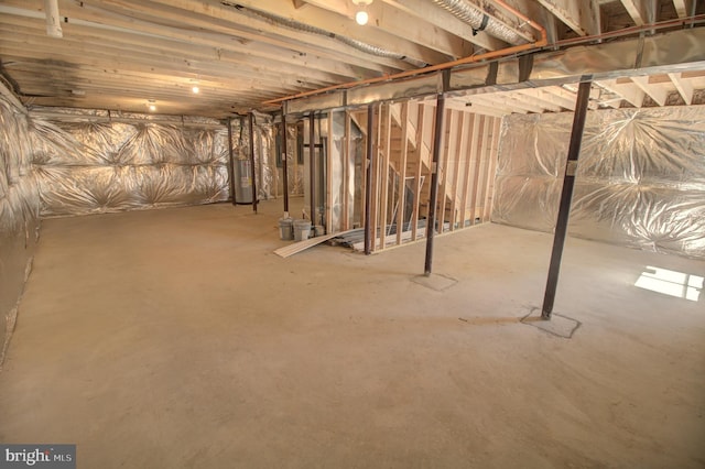 basement featuring electric water heater