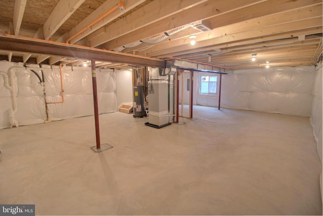 basement with heating unit and water heater