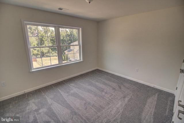 empty room with carpet flooring