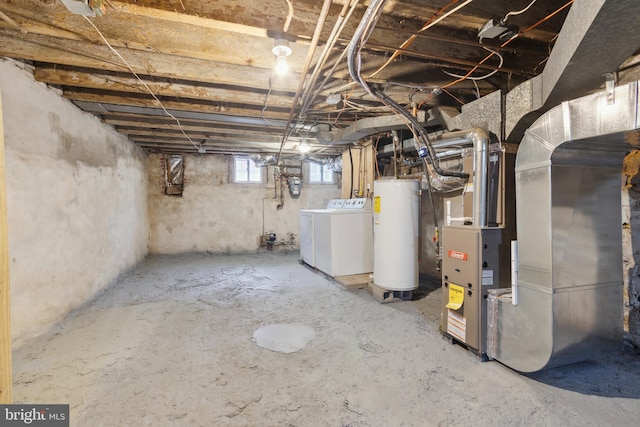 basement with washing machine and clothes dryer and gas water heater