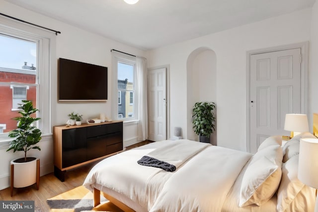 bedroom with light wood-type flooring