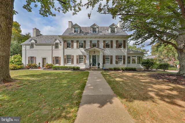 view of front of home with a front yard