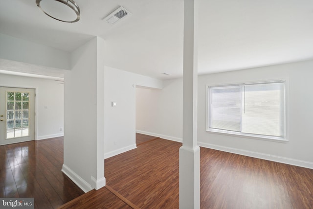 empty room with dark hardwood / wood-style floors