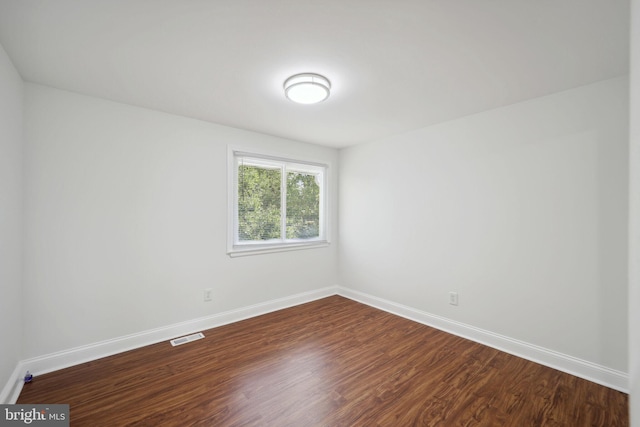 empty room featuring hardwood / wood-style flooring