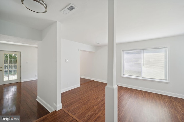 interior space with dark hardwood / wood-style flooring