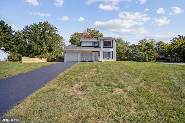 view of front of home with a garage and a front yard