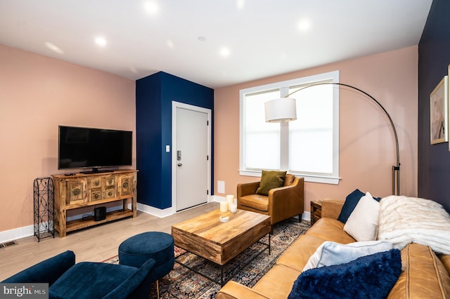 living room with light hardwood / wood-style floors