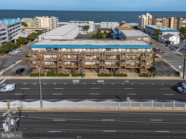 drone / aerial view with a view of city and a water view