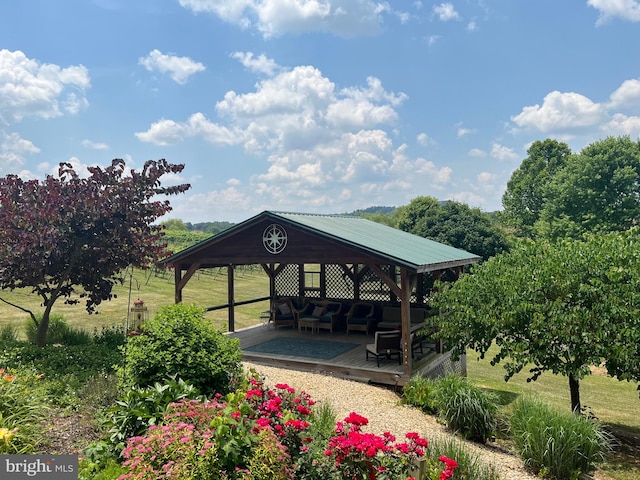 view of property's community featuring a deck and a gazebo