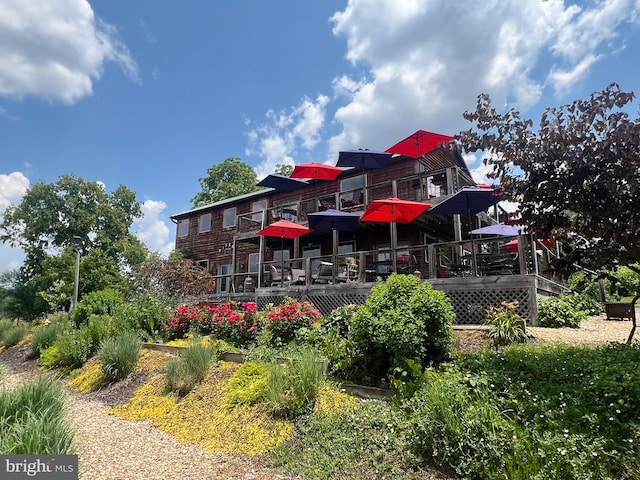 rear view of house with a wooden deck