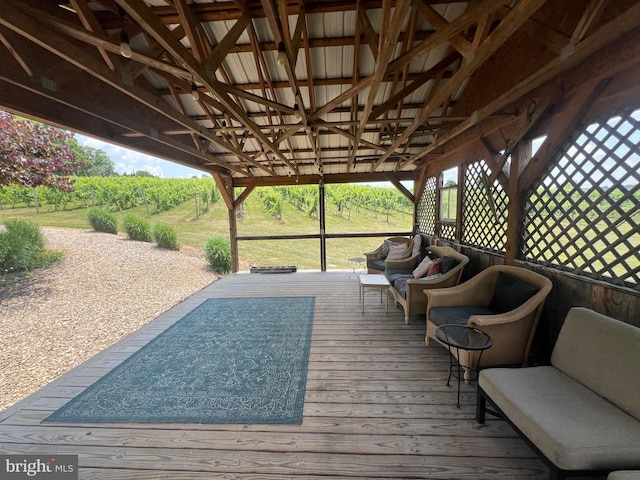 wooden terrace featuring an outdoor hangout area