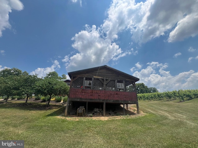 rear view of house with a yard