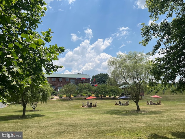 view of home's community featuring a lawn