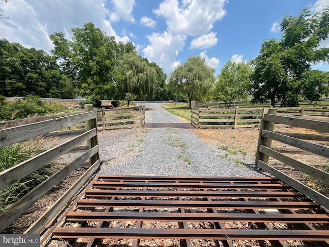 view of yard with a rural view