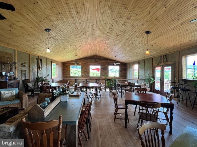 dining space featuring wooden ceiling, french doors, vaulted ceiling, and hardwood / wood-style flooring