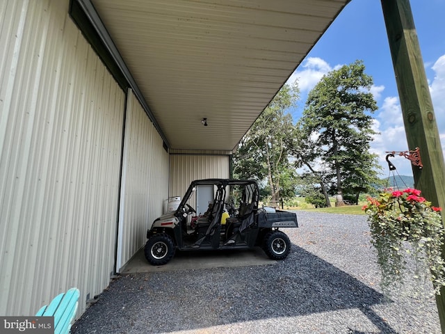 view of vehicle parking with an attached carport