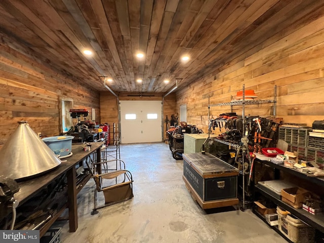 interior space with wood walls, wood ceiling, and a workshop area