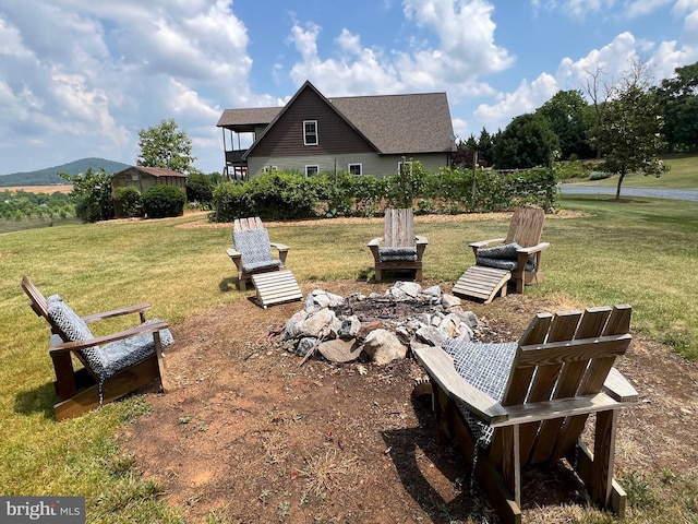 view of yard with a fire pit