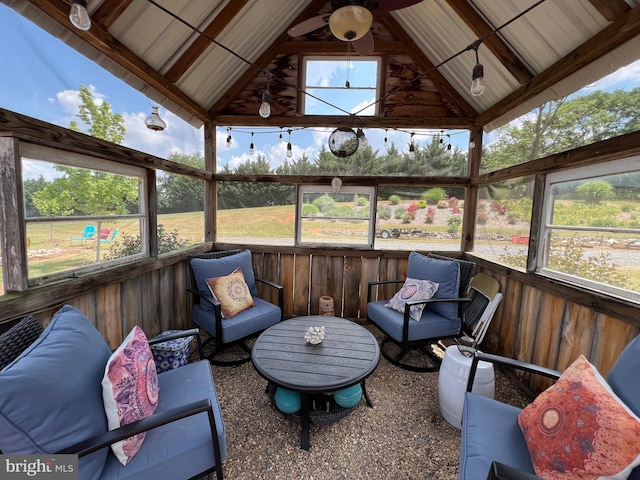 sunroom featuring lofted ceiling and a wealth of natural light