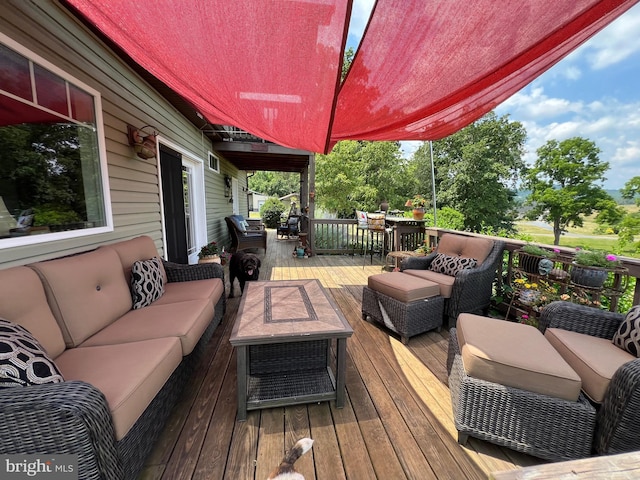 wooden deck featuring an outdoor hangout area