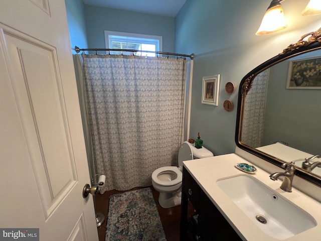 bathroom featuring curtained shower, hardwood / wood-style floors, toilet, and vanity