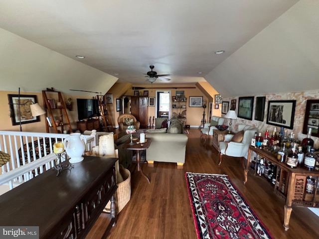 living room with lofted ceiling, ceiling fan, and dark hardwood / wood-style flooring