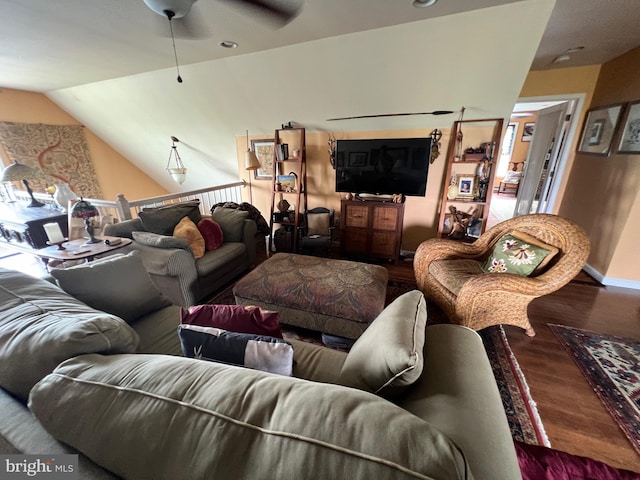 living room featuring lofted ceiling, hardwood / wood-style floors, and ceiling fan