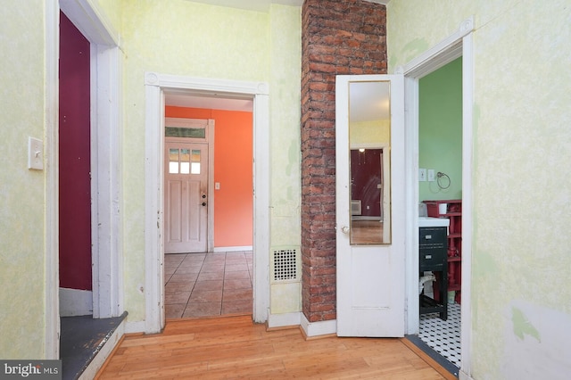 corridor featuring wood-type flooring