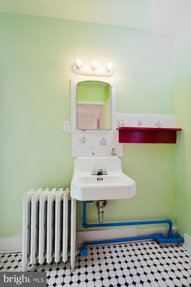 bathroom with radiator heating unit