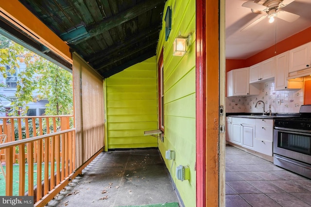 exterior space featuring ceiling fan and sink