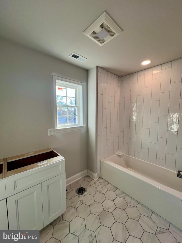 bathroom with tile patterned floors, visible vents, vanity, and baseboards