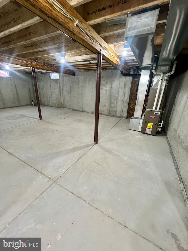 unfinished basement with heating unit