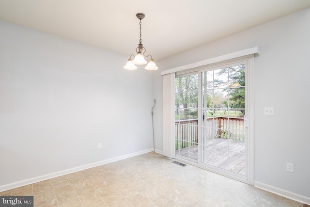 empty room featuring visible vents, baseboards, and an inviting chandelier