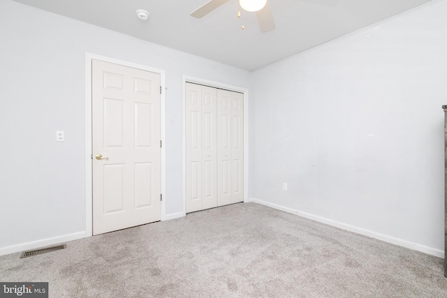 unfurnished bedroom featuring carpet and ceiling fan