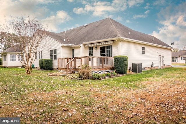 back of house featuring crawl space, central AC, a wooden deck, and a yard