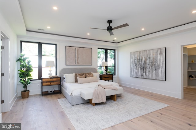 bedroom featuring ceiling fan and light hardwood / wood-style floors