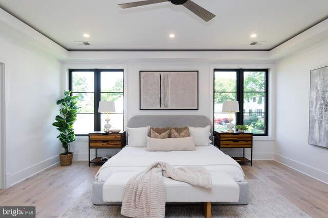 bedroom featuring light hardwood / wood-style flooring and ceiling fan