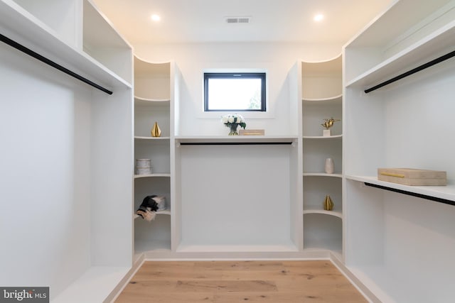 walk in closet featuring light wood-type flooring