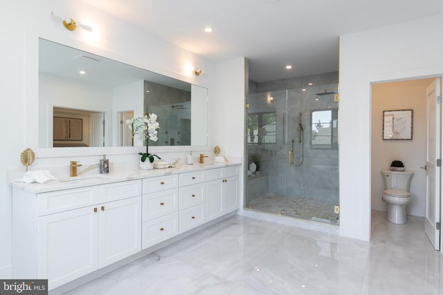 bathroom with vanity, toilet, and an enclosed shower