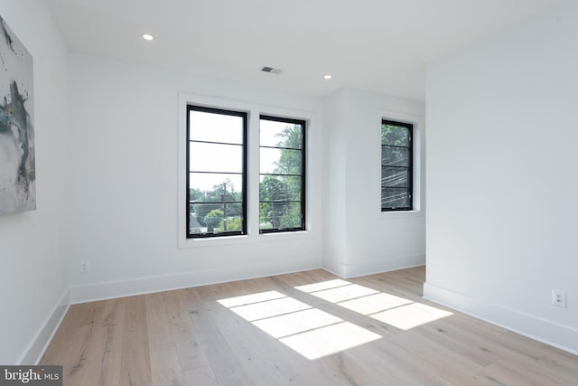 spare room with light wood-type flooring