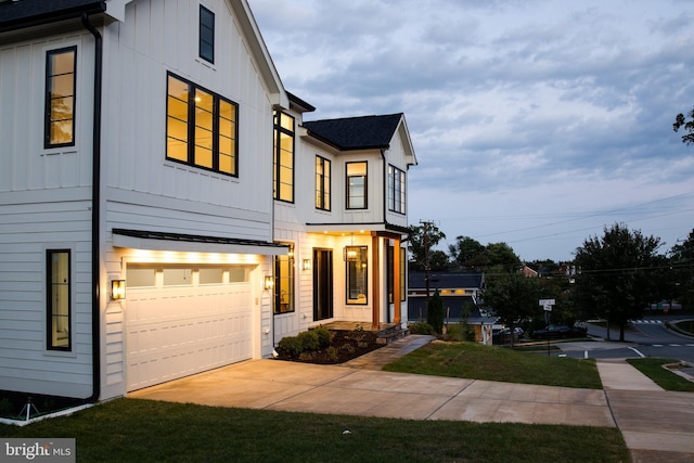 view of front of home featuring a garage and a front yard